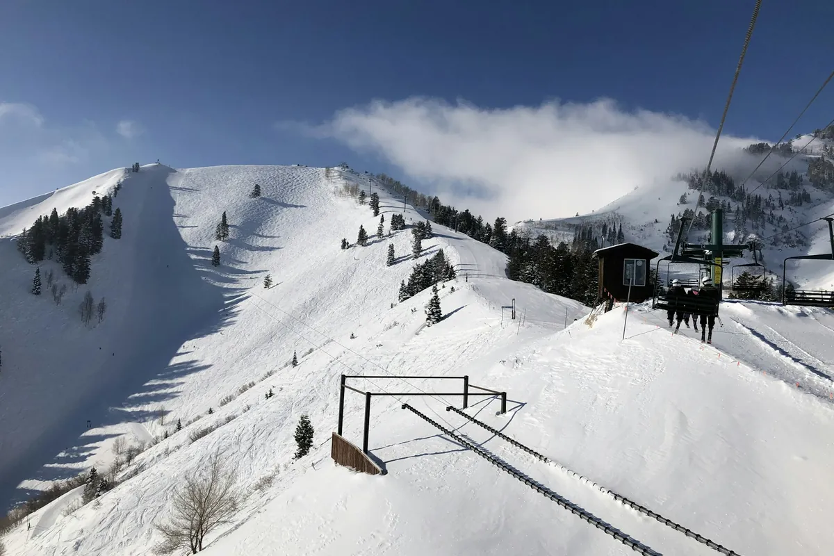 Chairlift above a snowy ski slope
