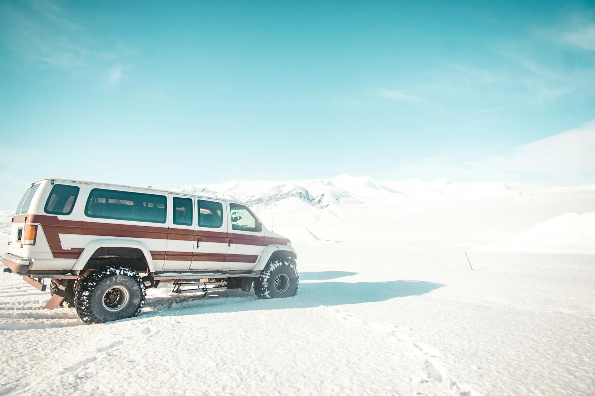 Minivan on a snowy mountain road